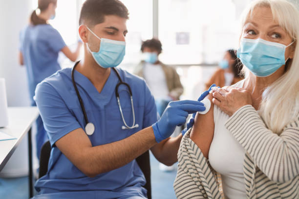 istock Mature Lady Preparing To Get Vaccinated Against Covid-19 1354036097