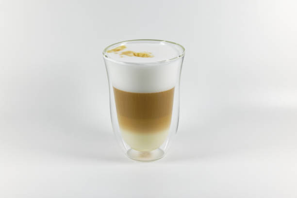 istock transparent termos cup with latte, white foam and brown coffee against white background, with shading, studio shot 1354036216