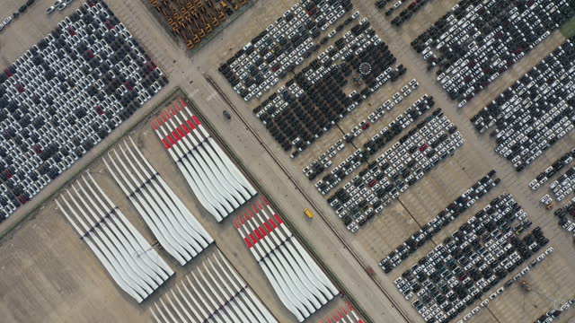 Real Time / Aerial view of stack of wind turbine blades