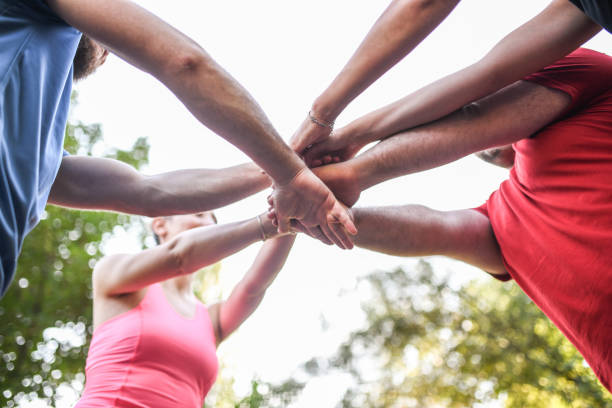 istock Teamwork Expressed By Smiling Friends After Tough Training 1354039220