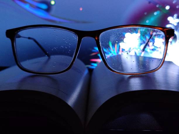 istock Spectacle Or glasses on book with beautiful background 1354039718