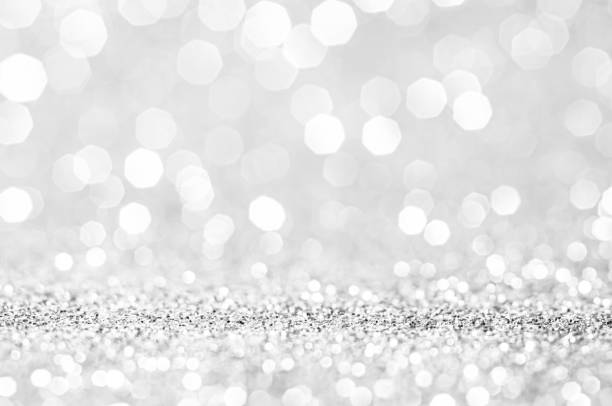 istock Abstract bokeh silver,white with light background.Grey color night light elegance,smooth backdrop,artwork design for new year,Christmas sparkling glittering or special day.Selective focus image. 1354044290