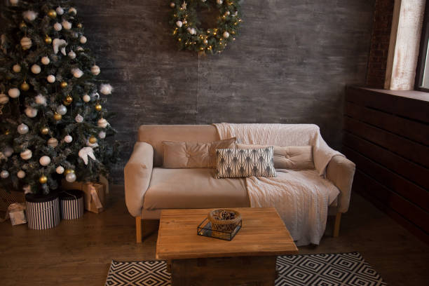 istock Decorated Christmas tree in stylish living room interior 1354044574