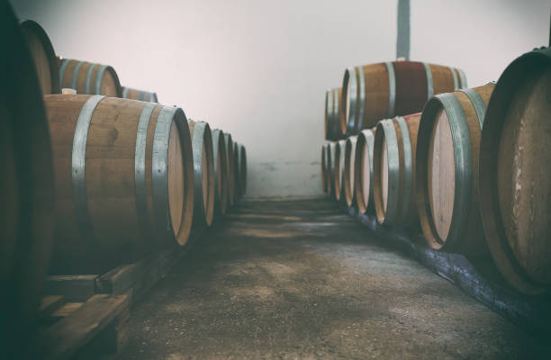 istock Wine barrels stacked in the cellar. 1354045535