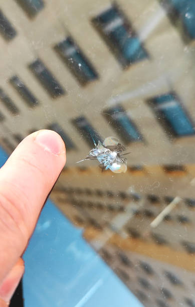istock Chipping on the windshield of the car. 1354045570