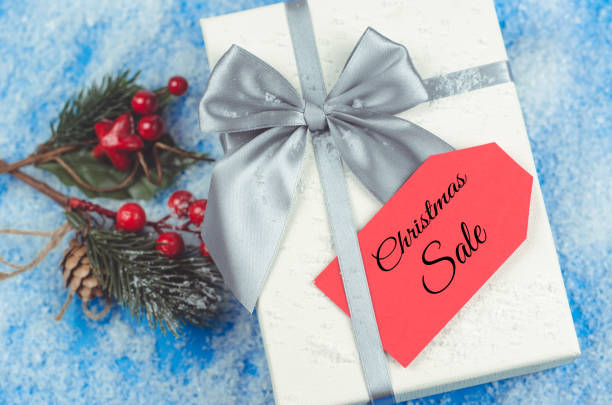 istock Red label on a gift box with the words Christmas Sale 1354048284
