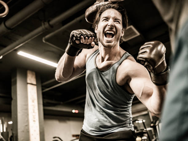 istock Two Young Men boxing in the Gym 1354048300
