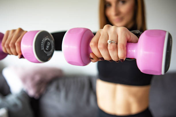 istock Woman practicing doing fitness at home 1354055148