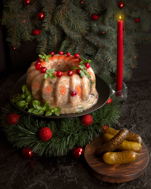 Homemade delicious jelly meat on the festive Christmas table. Perfect cold meat, aspic, galantine with carrots. Russian cuisine Homemade delicious jelly meat on the festive Christmas table. Perfect cold meat, aspic, galantine with carrots. Russian cuisine aspic stock pictures, royalty-free photos & images