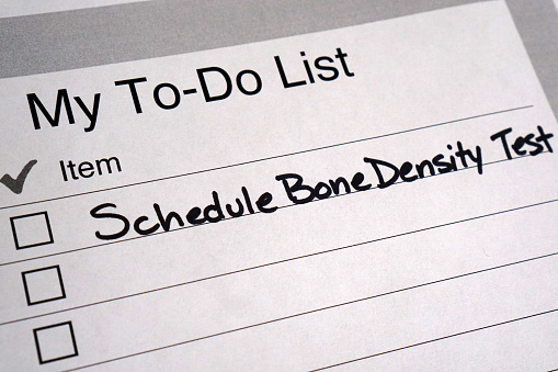 Handwritten to do list reminder to schedule a bone density test. May is Osteoporosis Awareness Month.