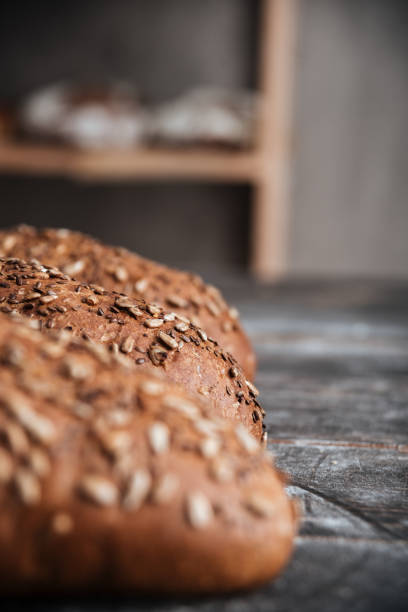istock Bread on dark wooden table at bakery 1354057004