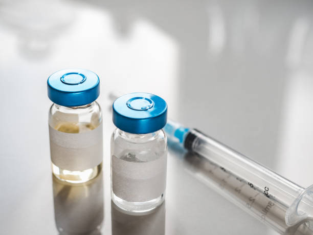 istock Syringes, injection bottles and tablets lying on the table 1354059445