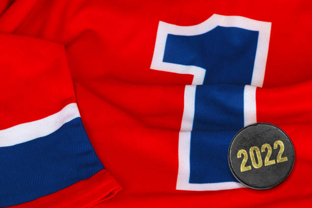 istock Red hockey jersey and puck 1354060402
