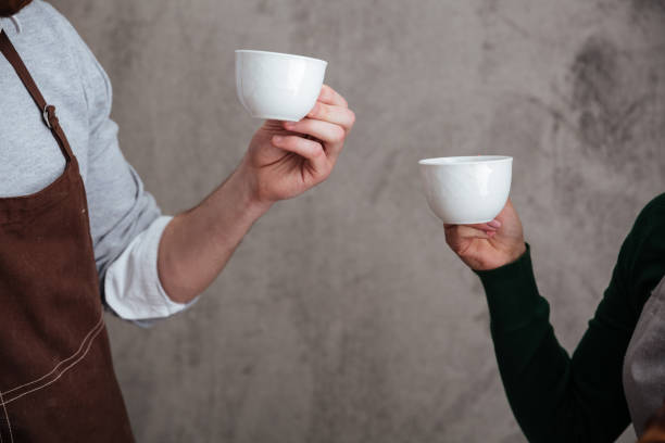 istock Loving couple bakers drinking coffee. 1354060725