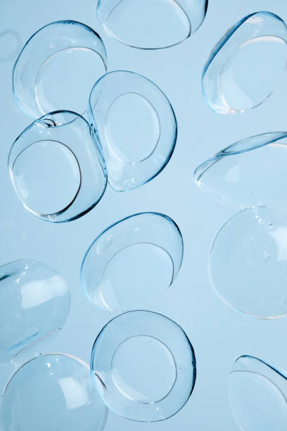 contact lenses on blue background close up view