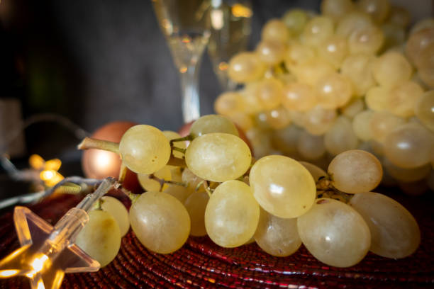 istock Lucky grapes with cups in the background. 1354063548