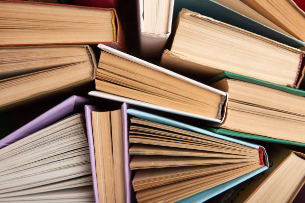 istock Books pattern background for wisdom, science and education. Reading and writing concept 1354063828