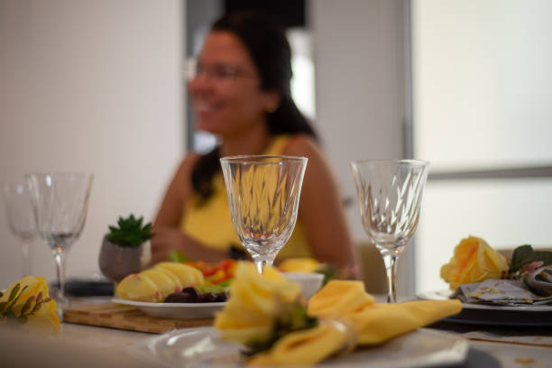 young woman smiling at the table. table set. snack