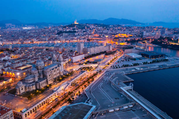 Bird's eye view of Marseille at dusk Bird's eye view of Marseille at dusk. Marseille Cathedral visible from above. old port photos stock pictures, royalty-free photos & images