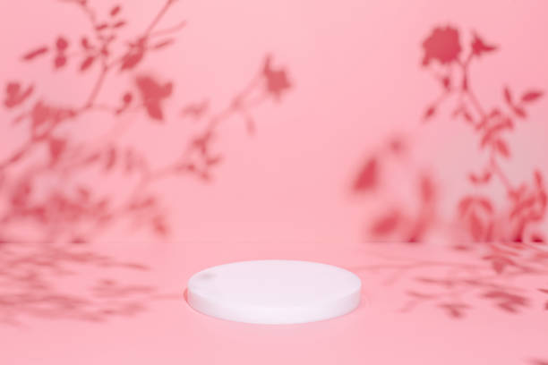 istock scene with circle podium on pink background and shadows 1354065880