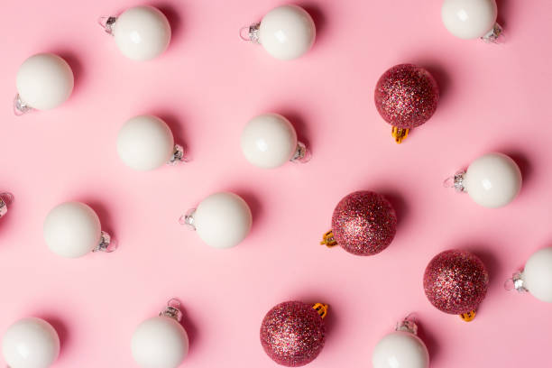 istock Christmas and New Year composition with Christmas tree decorations on a pink background 1354066860