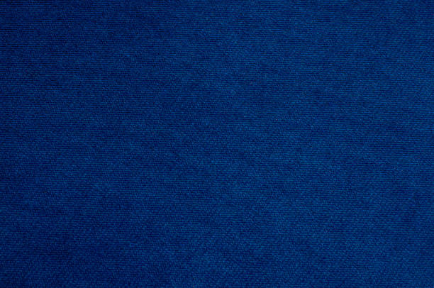 生地の質感は濃い青色のベロアです。背景ベルベットの家具 - felt blue textured textile ストックフォトと画像