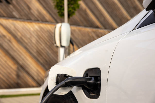 istock Charging an electric car at parking lot 1354069479
