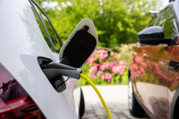 istock Charging an electric car at home 1354069529