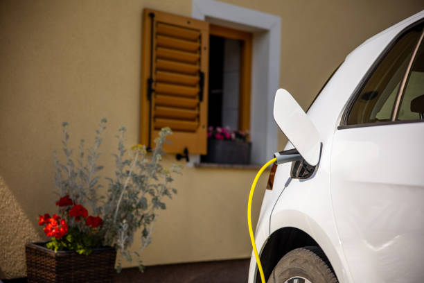 istock Charging an electric car at home 1354069538