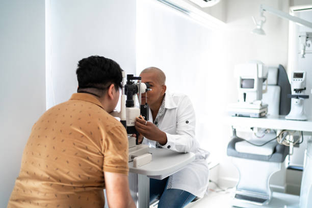 Ophthalmologist examining patient's eyes