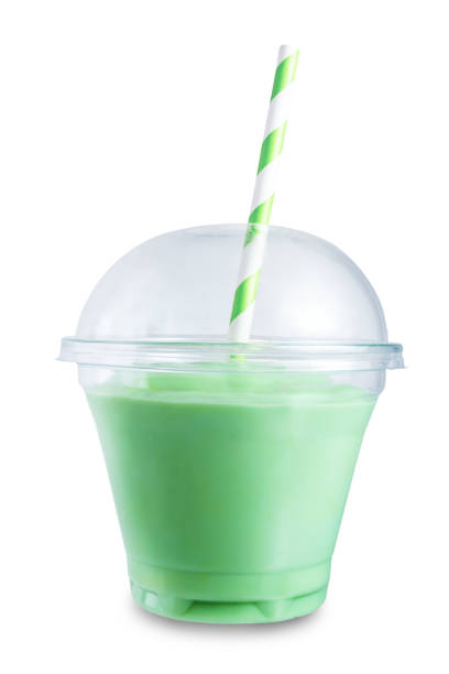 istock Milk fruit cocktail smoothie in a plastic glass with a straw on a white isolated background 1354071764