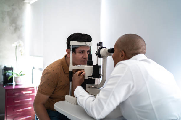 Ophthalmologist examining patient's eyes