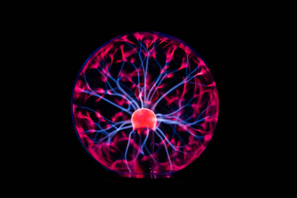 istock Plasma ball glowing  in the dark 1354072268