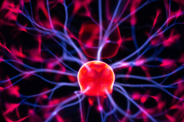 istock Plasma ball glowing  in the dark 1354073047