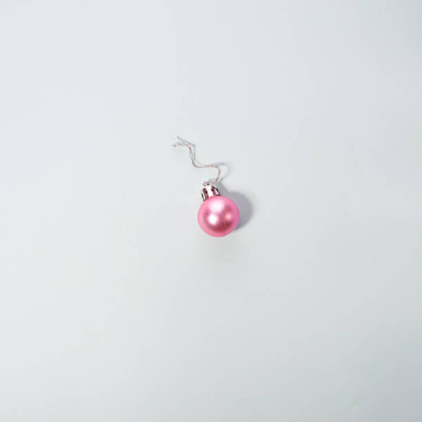 istock christmas pink ball minimalism on a blue background 1354073465