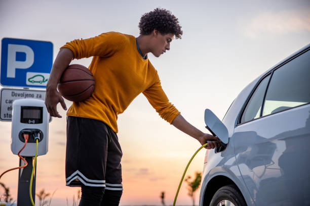 istock Basketball player charging an electric car 1354073552