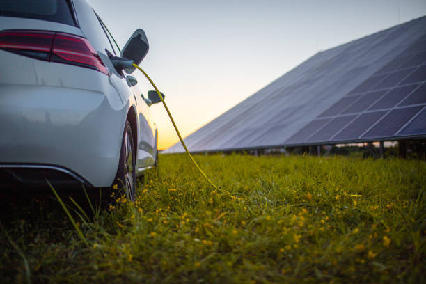 istock Charging electric car and solar panels 1354075251