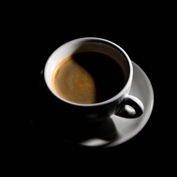 istock cup of coffee on black background 1354076473