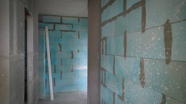 istock Renovation in a multi-storey building. Finishing inside a new multi-storey building. Interior decoration of the apartment. Construction of a multi-storey building, inside view 1354077282