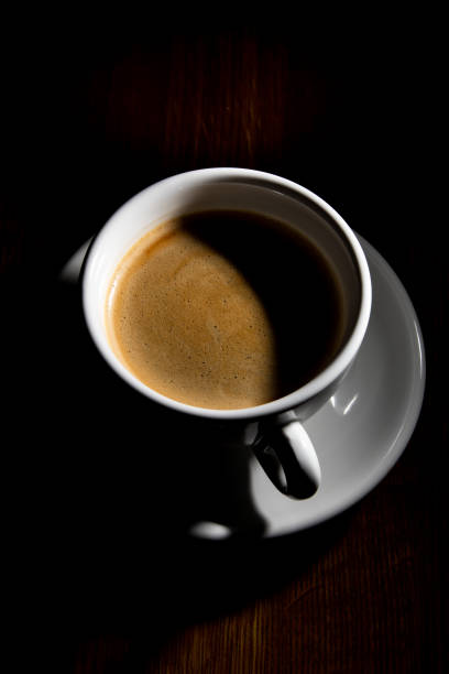 istock cup of coffee on black background 1354077348