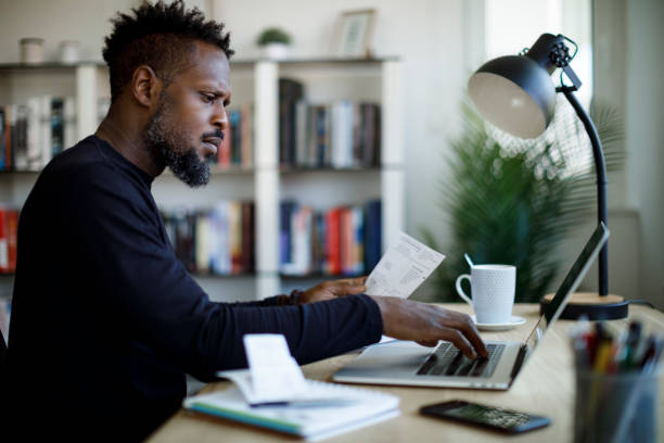 istock Worried man calculating budget and finances 1354077370