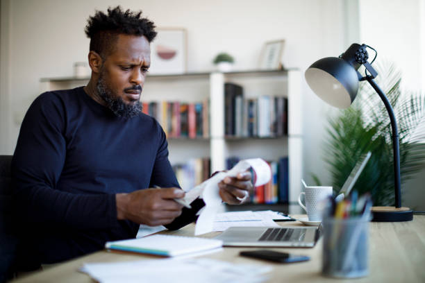 istock Man calculating budget and finances 1354077694