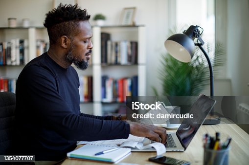 istock Man calculating budget and finances 1354077707