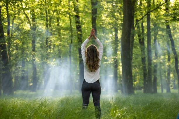 istock Rear view of woman joining hands 1354077797