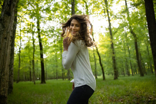 istock Cheerful young woman dancing 1354079019