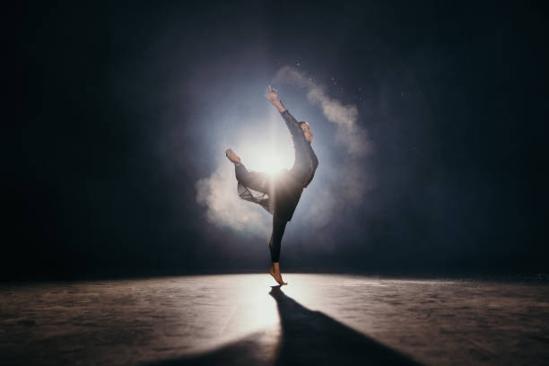 Young ballerina throws the dust out of her hand while dancing