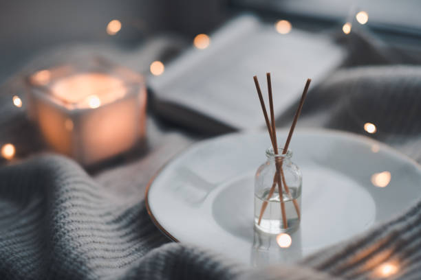 istock Cozy home atmosphere with perfume in glass bottle 1354083406