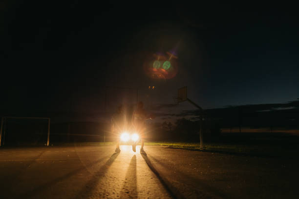 istock Basketball player defending ball from opponent at night 1354083672