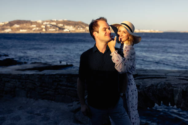 istock romantic couple resting by the sea in Greece 1354083996