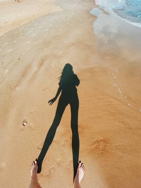 iPhone photo of a female shadow on the sand